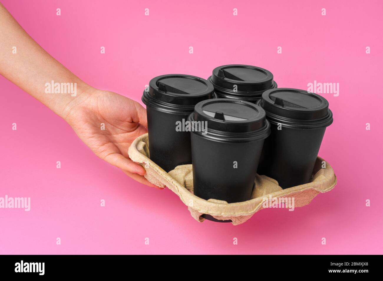Coffee delivery. Human hand holding takeaway coffee cup Stock Photo Alamy