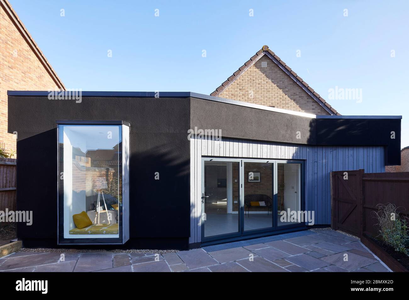 Side Elevation with deep black render. Cut & Wrap House, Hemel