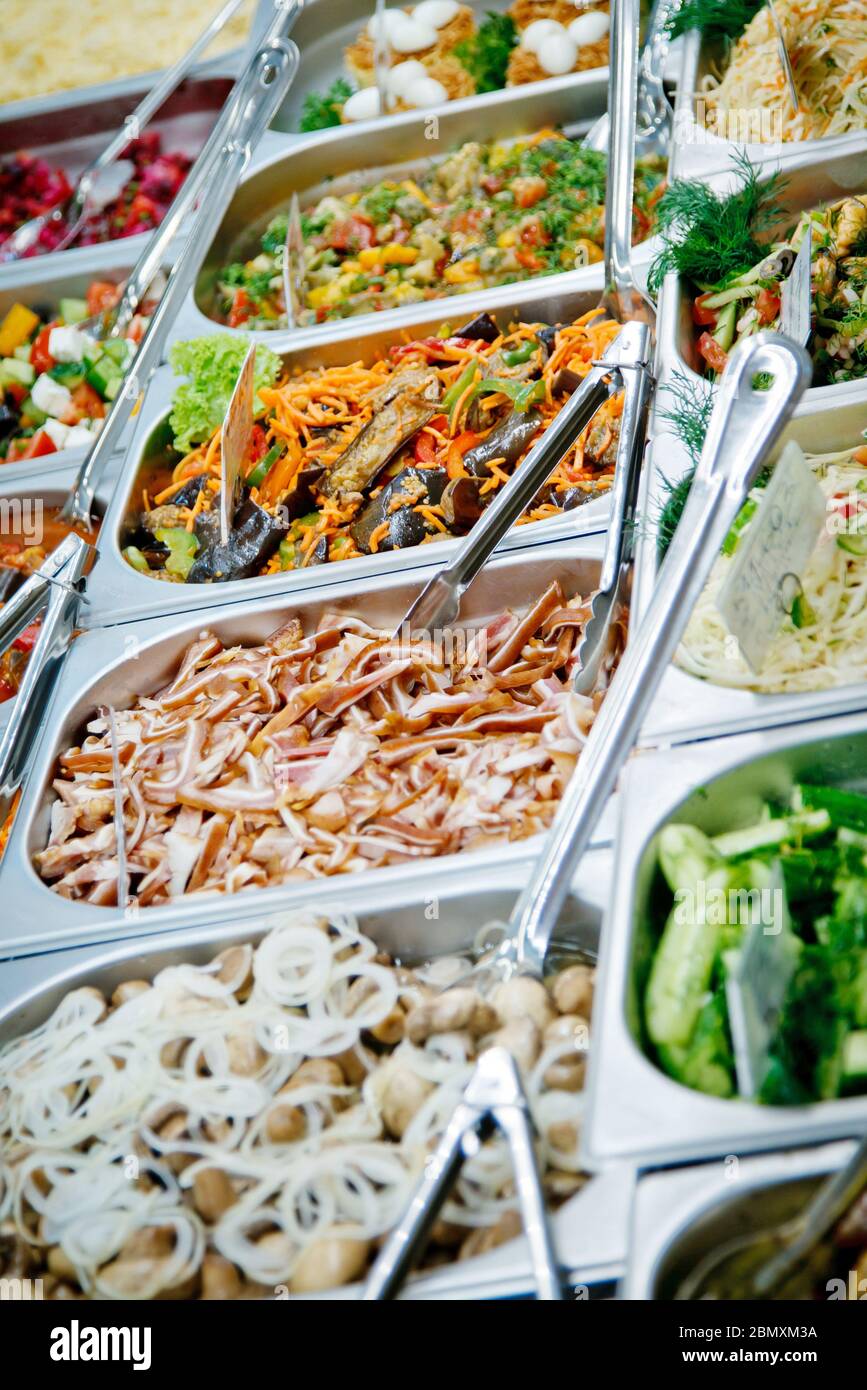 Salads, marinated champignons with onion rings, sliced bacon, stewed ...