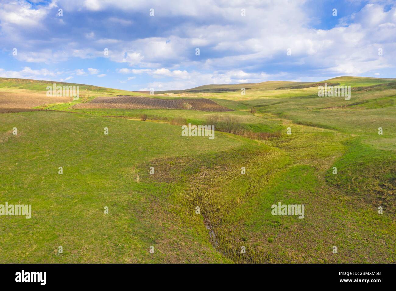 Water stream valley in a rural landscape during springtime Stock Photo ...