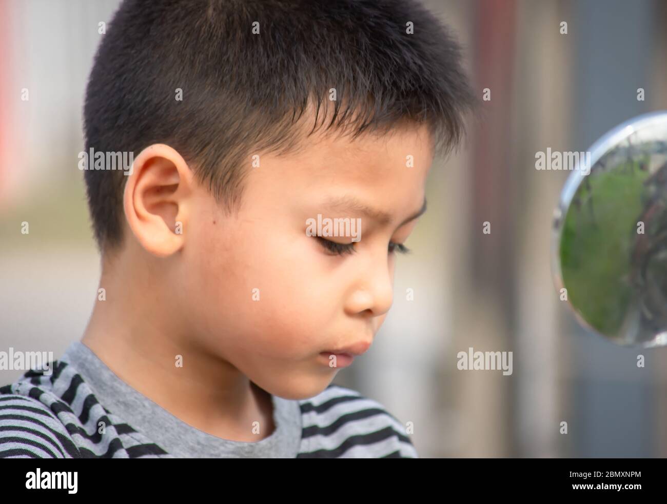 Portrait of Asian boy Tired expression Stock Photo