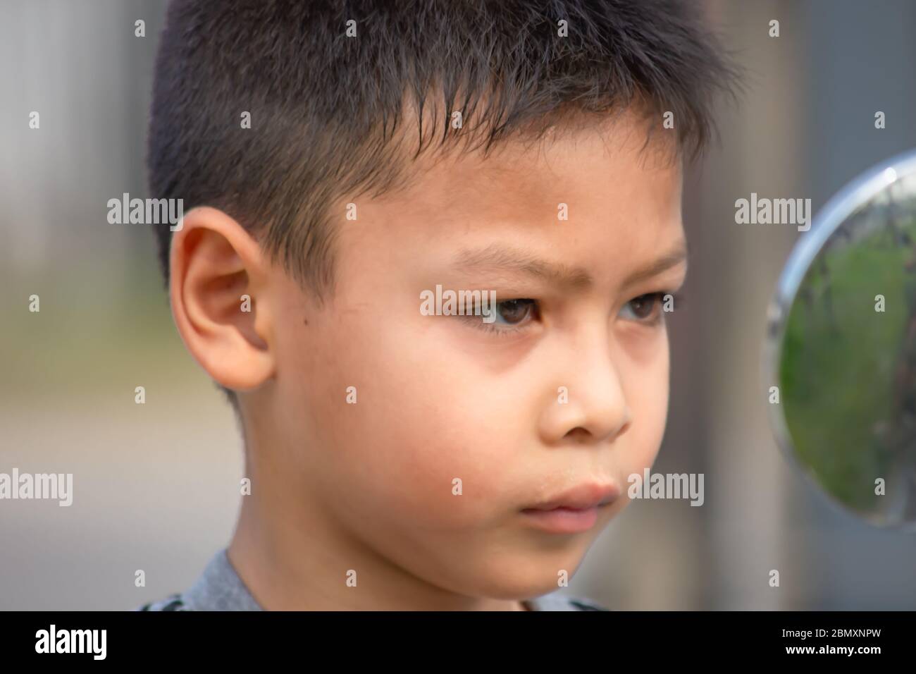 Portrait of Asian boy Tired expression Stock Photo