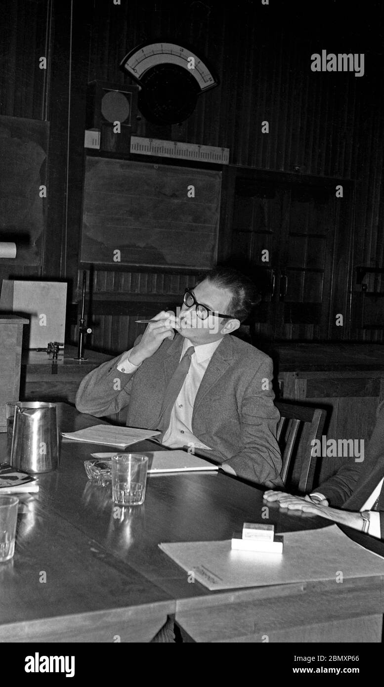 The proposer of a motion calling for the scrapping of the monarchy, Brian Lapping, listens during a Bristol University Union Debate in the main lecture theatre in the Royal Fort on Friday 15 November 1968.  He was supported by undergraduate Roger Berry, later a Bristol Labour MP.  The motion was opposed by Conservative peer Arthur Gore, 8th Earl of Arran, and David Smith.  Nonesuch, the student newspaper, reported they could not see the need for “something new when the old model is working well” and they won the vote.  The Earl, who the year before had led the effort in the House of Lords to d Stock Photo