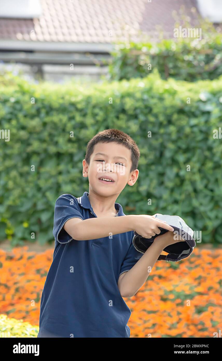 Portrait of Asean boy , laughing and smiling happily in the park. Stock Photo