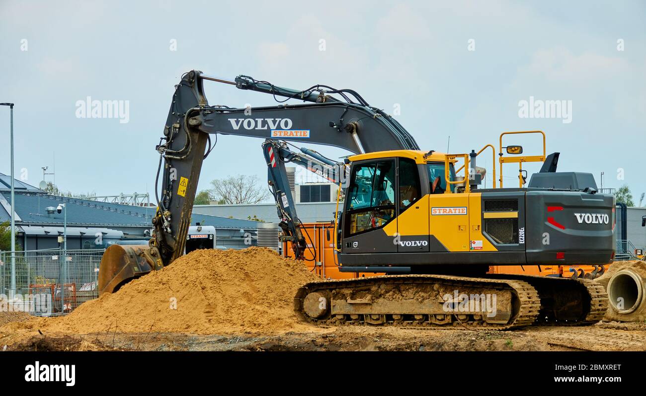 Braunschweig, Germany, May 2., 2020: Volvo brand excavator on a pile of sand at the construction site Stock Photo