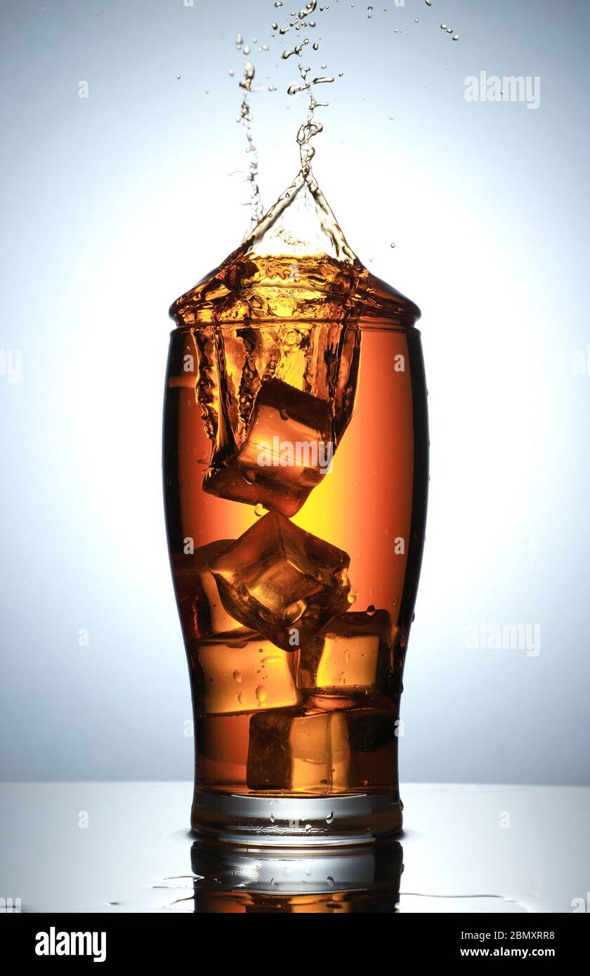 Cold Drink Splash with Ice Cubes Stock Photo - Alamy