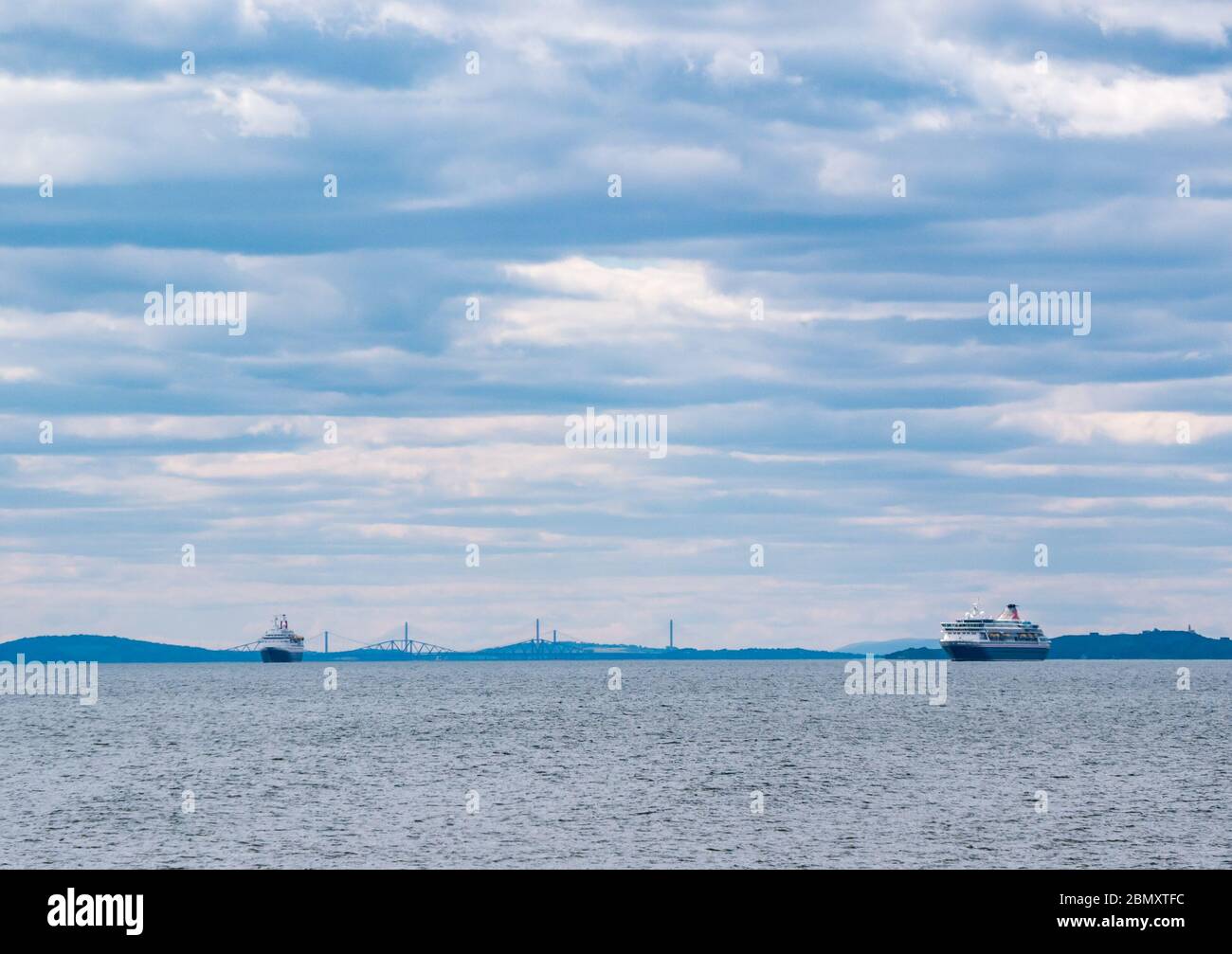 East Lothian, Scotland, United Kingdom, 11th may 2020. UK Weather: Quiet at the reserve during the Covid-19 lockdown with Fred Olsen mothballed out of service cruise ships anchored seen in the Firth of Forth and the three bridges in the distance Stock Photo