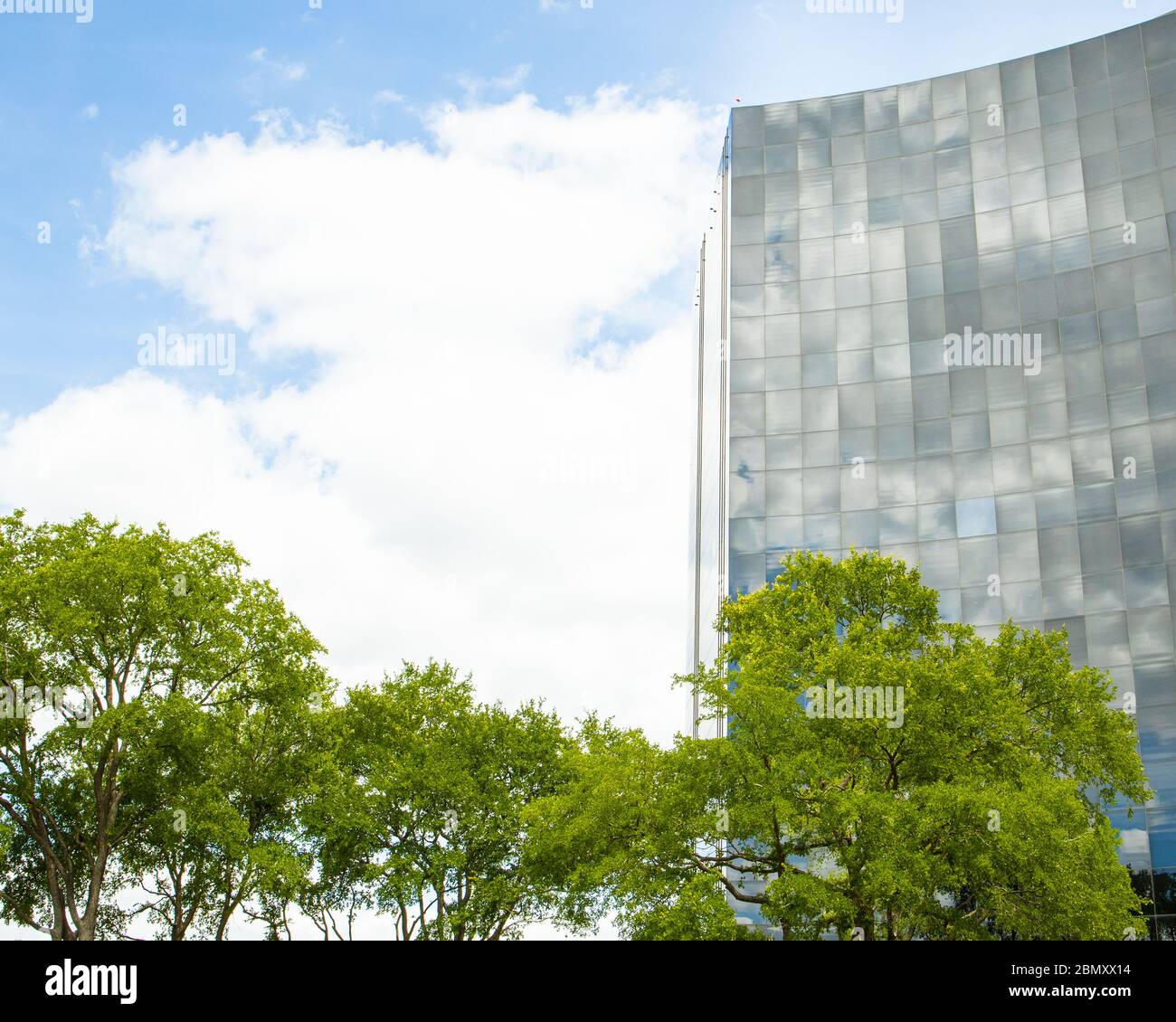 Tall modern office tower illustrates a contemporary workplace in Texas Stock Photo
