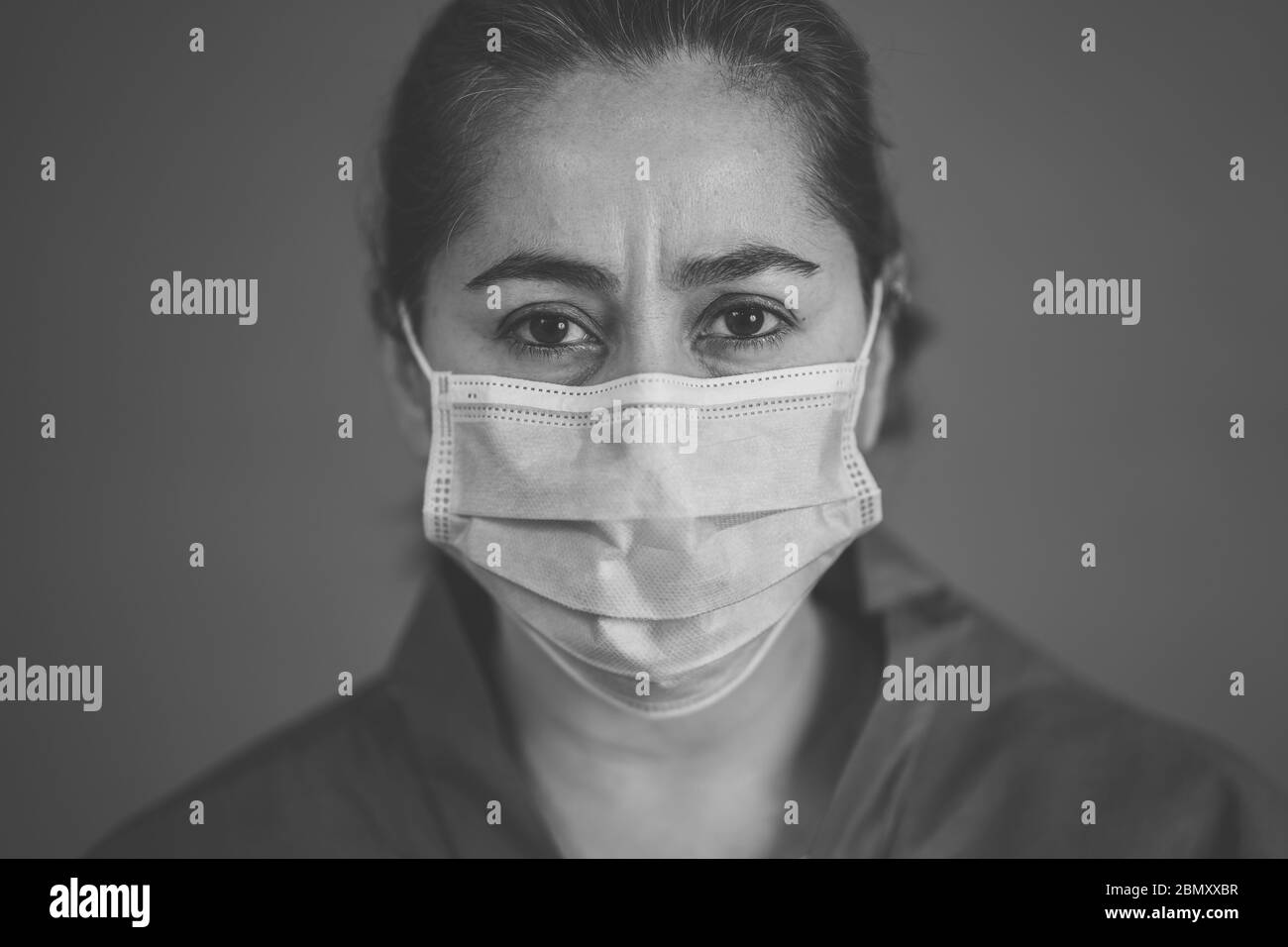 Stop the spread and Save lives campaign. Doctor wearing protection face mask. Protect yourself and others medical advice, basic protective measures ag Stock Photo