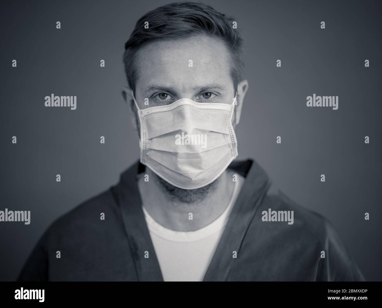Exhausted care worker wearing face mask hi-res stock photography and ...
