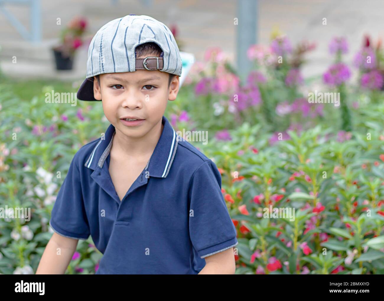 Portrait of Asean boy , laughing and smiling happily in the park. Stock Photo