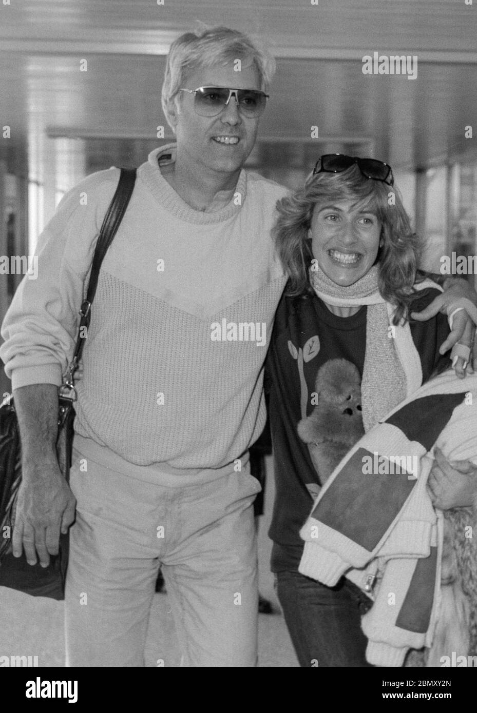American Jazz singer Jack Jones and wife Kim Ely arriving at London's  Heathrow Airport in 1985 Stock Photo - Alamy