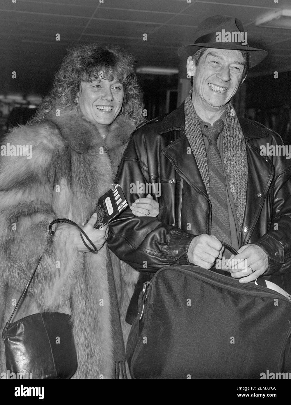 British actor John Hurt and wife Donna leaving Londons Heathrow Airport in  1985 Stock Photo - Alamy