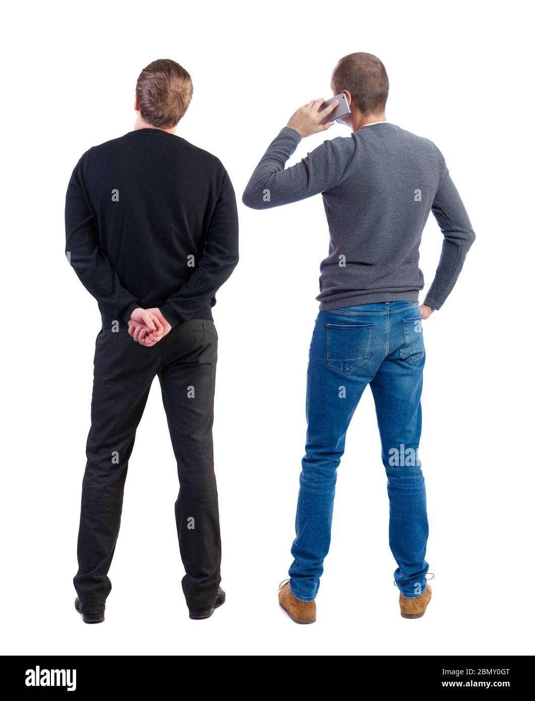 Back view of two man in sweater with mobile phone. Rear view people ...
