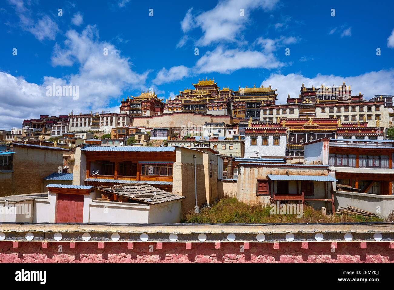 Ganden Sumtsenling Monastery on a sunny day (also known as Sungtseling or Little Potala Palace), Yunnan, China. Stock Photo