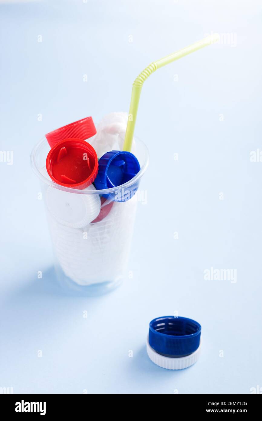 Danger cocktail from plastic bag and bottle caps with colorful straw ...