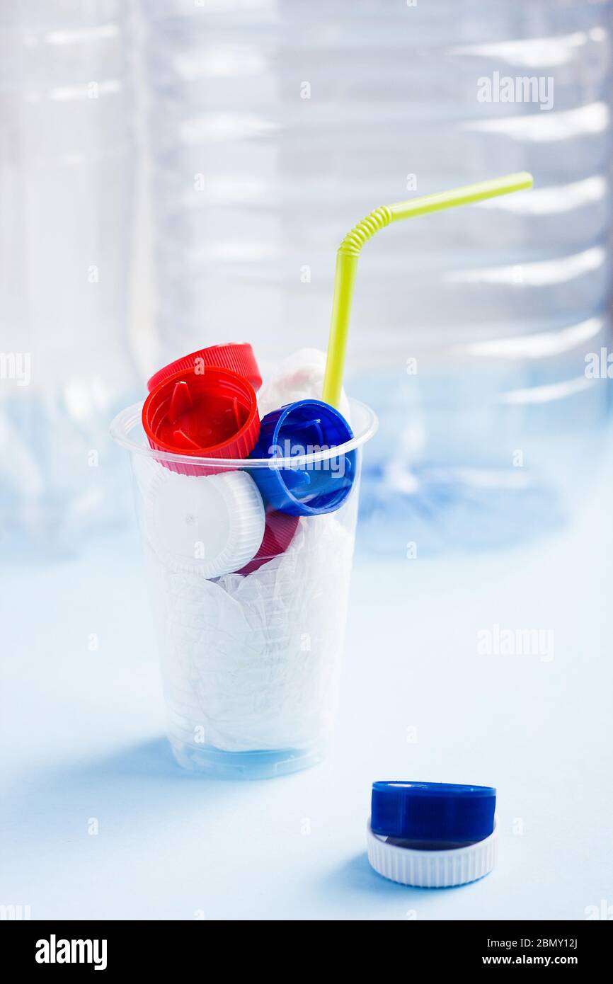 Danger cocktail from plastic bag and bottle caps with colorful straw ...