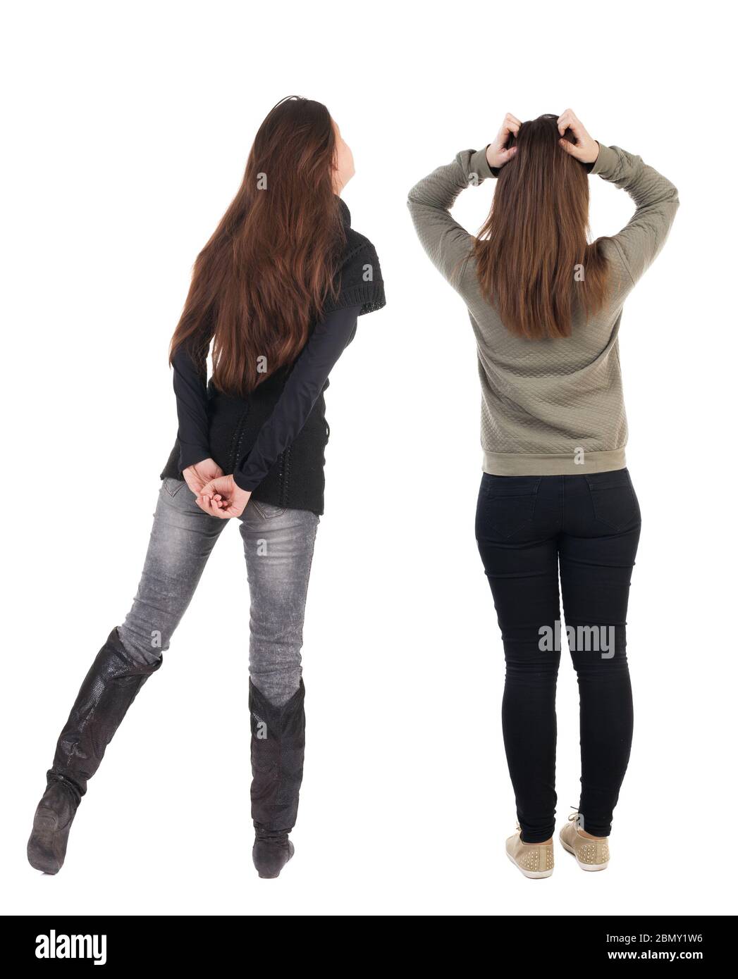 Back view of two woman in sweater. Rear view people collection ...