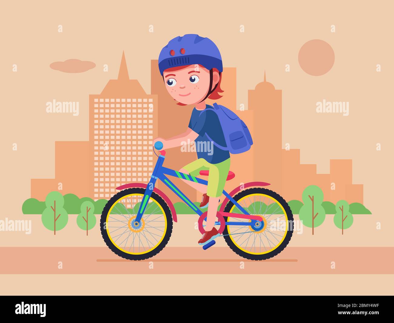 Boy rides a bike in the park. Kid in a helmet with a backpack drives a ...