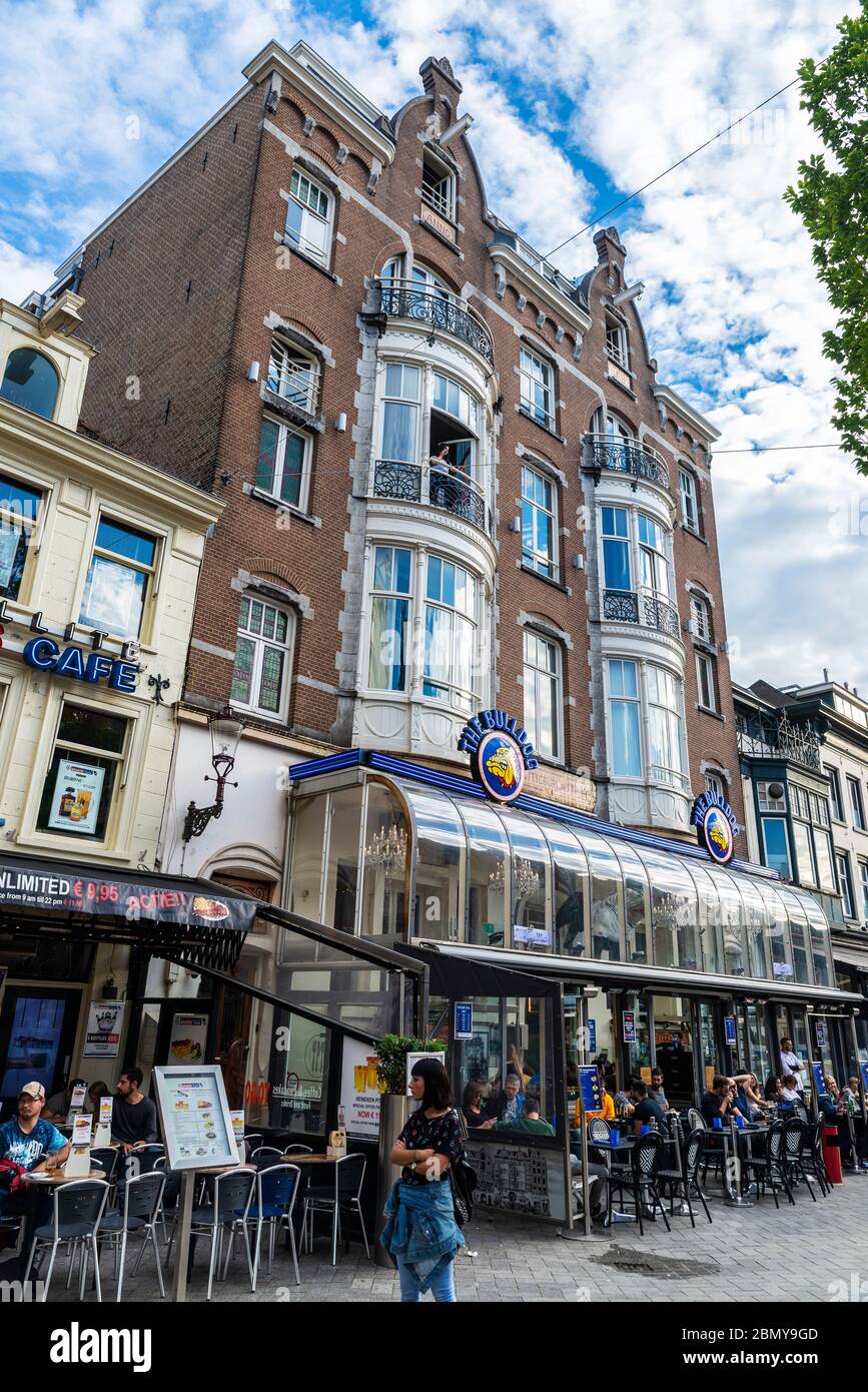 Amsterdam, Netherlands - September 9, 2018: Facade of the Bulldog cannabis coffee shop with people around in the old town of Amsterdam, Netherlands Stock Photo