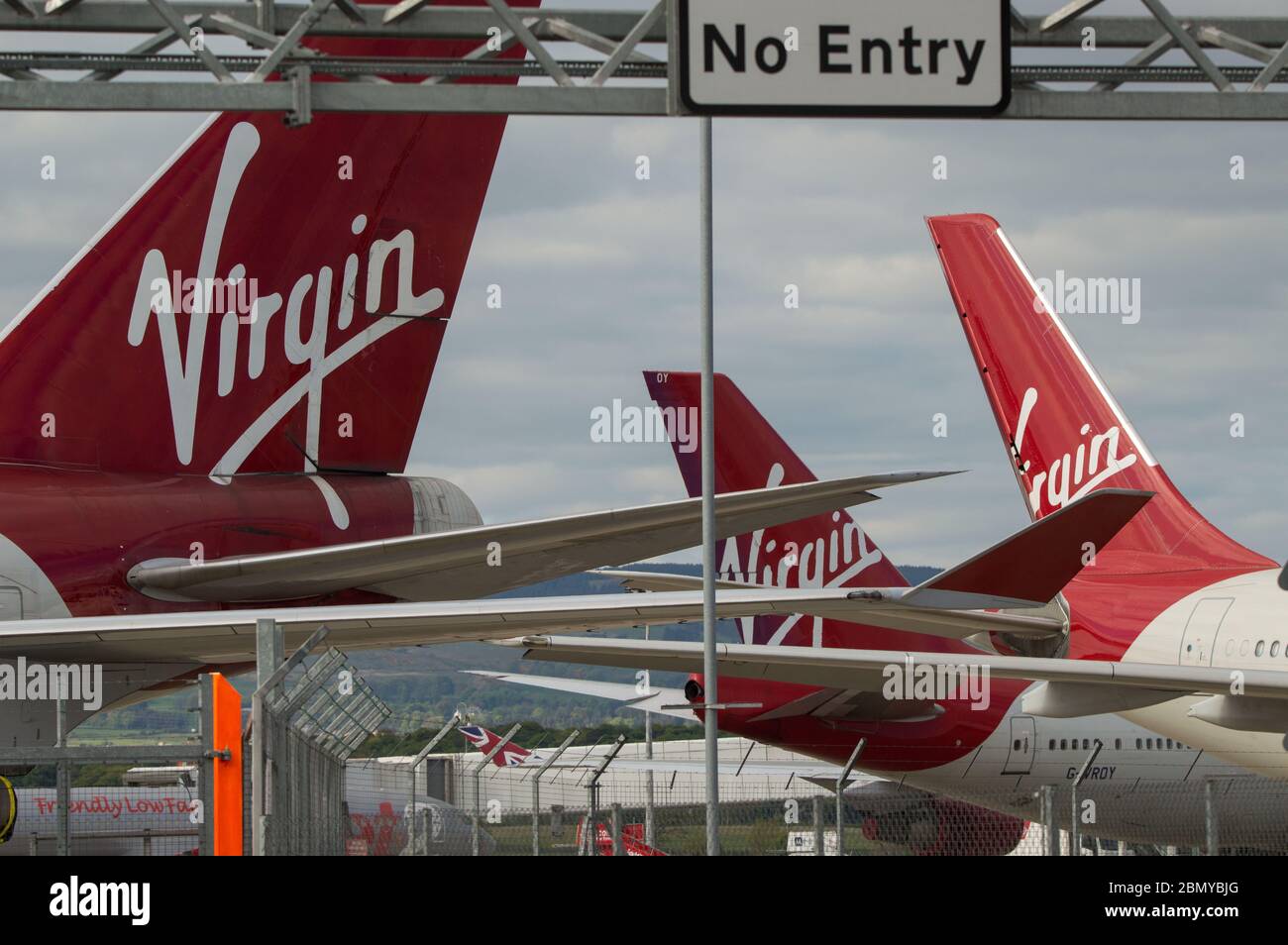 Glasgow, UK. 11 May, 2020.  Pictured: Virgin Atlantic move more of their aircraft to Glasgow Airport for storage during the Coronavirus (COVID19) extended lockdown. Seen on the Tarmac are two Boeing 747-400 and two Airbus A330-300 Aircraft.   So far Virgin Atlantic announced they will close down their operations at Gatwick Airport indefinitely, which will have massive knock on effect for other airlines and the south of England. Stock Photo