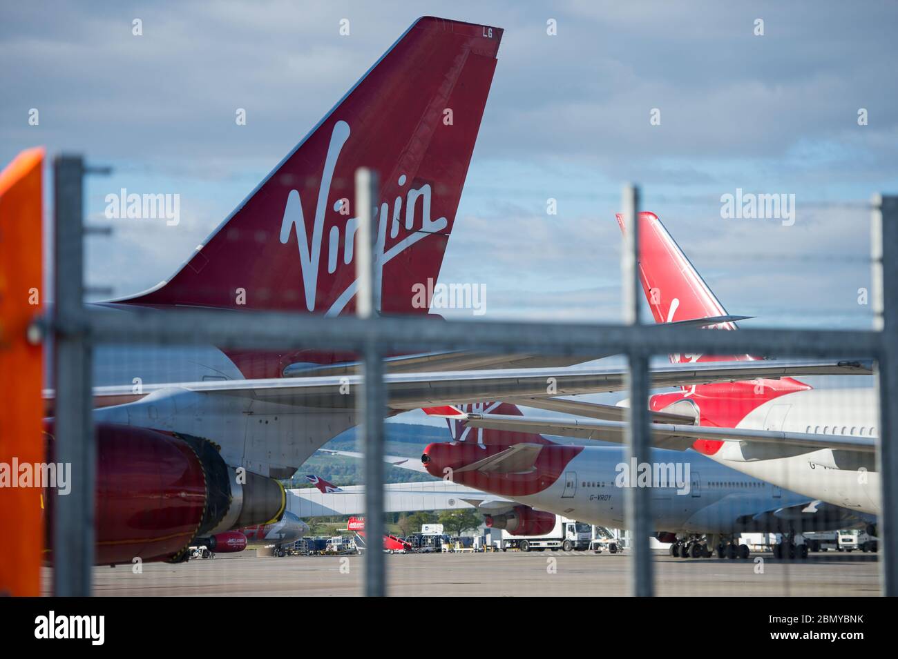 Glasgow, UK. 11th May, 2020. Pictured: Virgin Atlantic move more of their aircraft to Glasgow Airport for storage during the Coronavirus (COVID19) extended lockdown. Seen on the Tarmac are two Boeing 747-400 and two Airbus A330-300 Aircraft. So far Virgin Atlantic announced they will close down their operations at Gatwick Airport indefinitely, which will have massive knock on effect for other airlines and the south of England. Credit: Colin Fisher/Alamy Live News Stock Photo