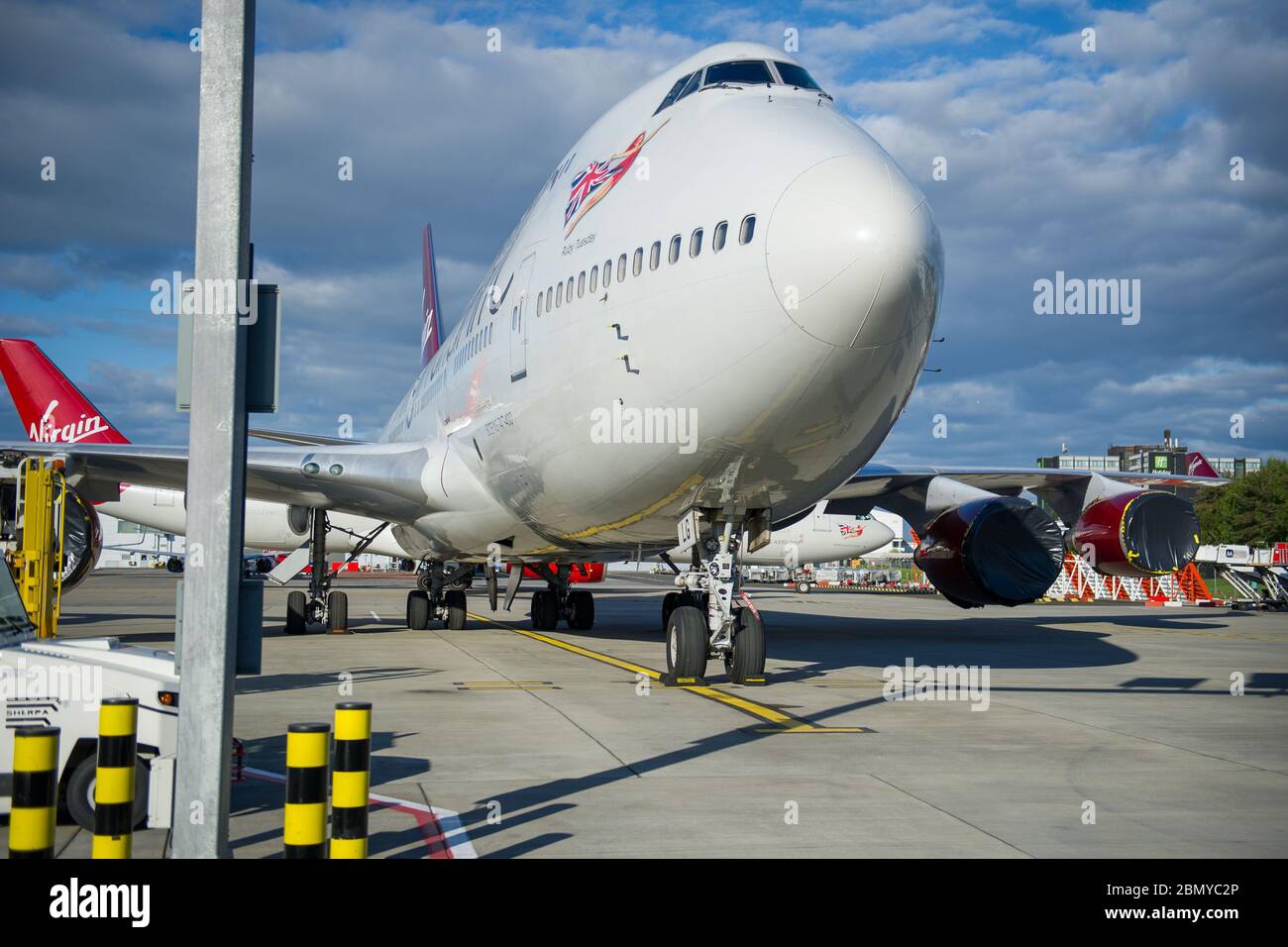 Glasgow, UK. 11th May, 2020. Pictured: Virgin Atlantic move more of their aircraft to Glasgow Airport for storage during the Coronavirus (COVID19) extended lockdown. Seen on the Tarmac are two Boeing 747-400 and two Airbus A330-300 Aircraft. So far Virgin Atlantic announced they will close down their operations at Gatwick Airport indefinitely, which will have massive knock on effect for other airlines and the south of England. Credit: Colin Fisher/Alamy Live News Stock Photo