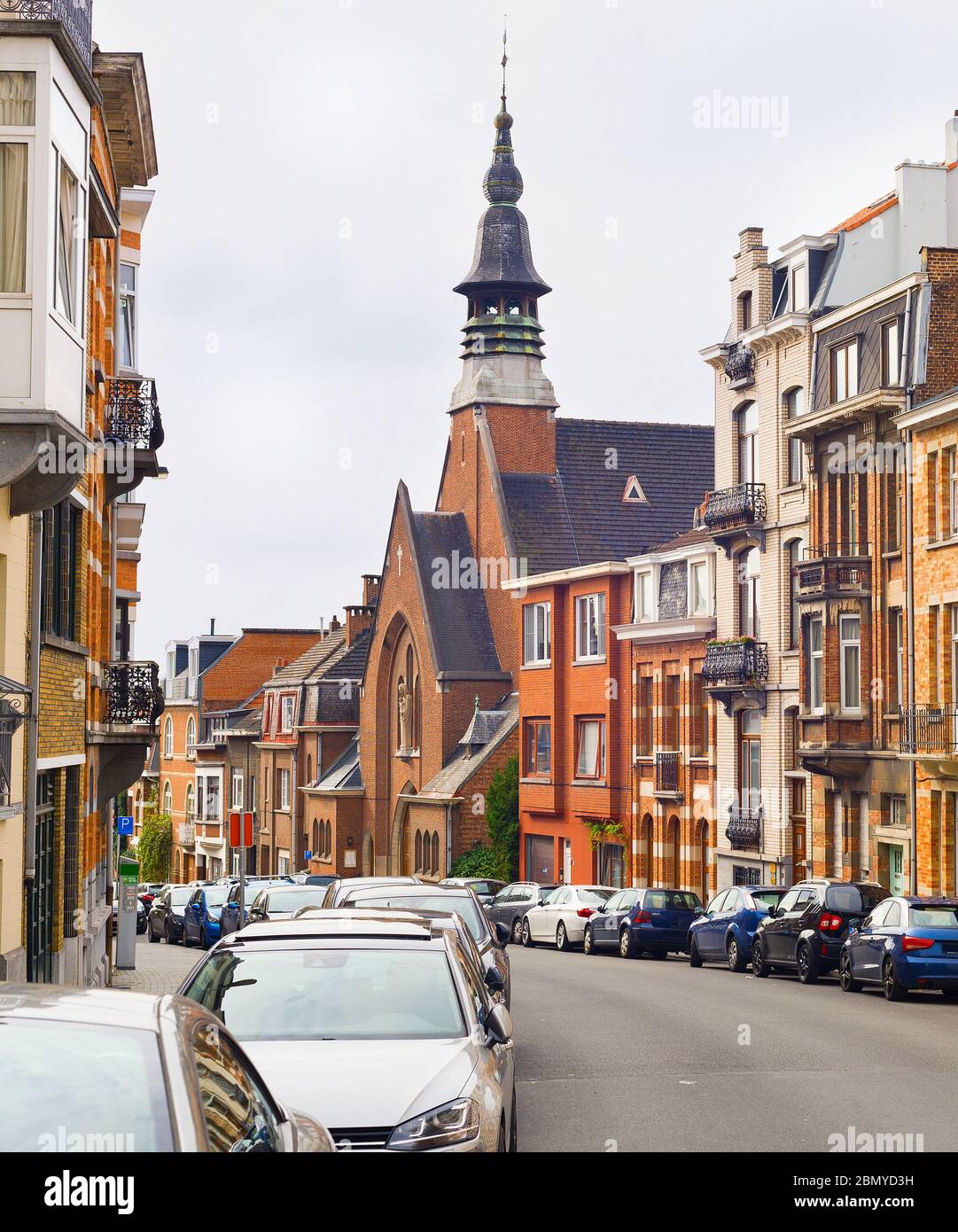 Brussels traditional architecture street. Cars parked by the buildings