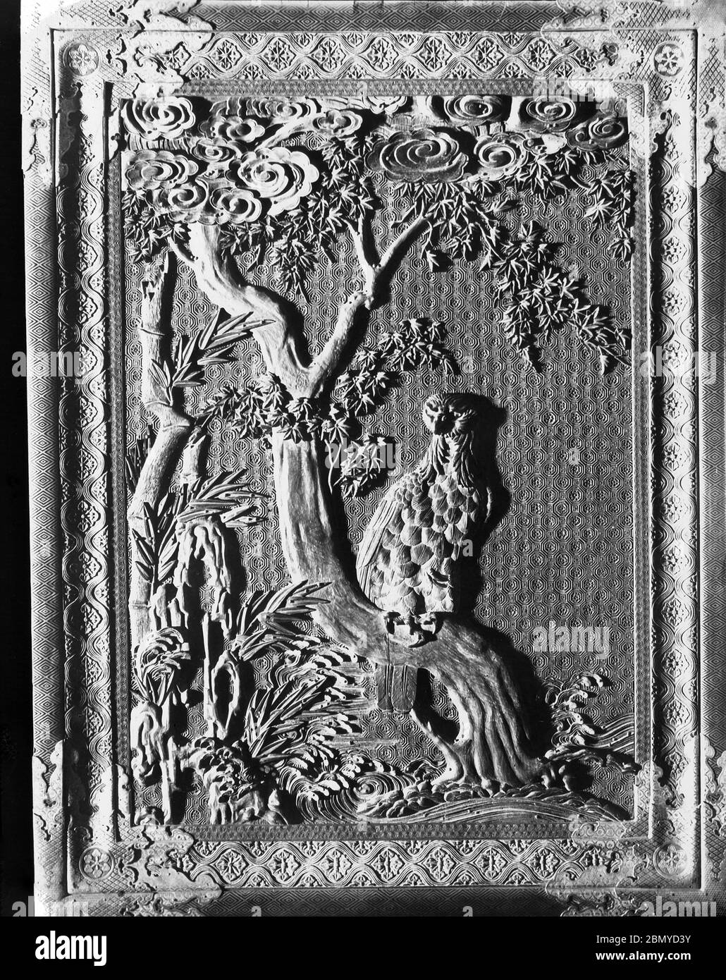 [ 1890s Japan - Japanese Wood Carving ] —   Wood carving at Nikko, Tochigi Prefecture.  From a series of glass slides published (but not photographed) by Scottish photographer George Washington Wilson (1823–1893). Wilson’s firm was one of the largest publishers of photographic prints in the world.  19th century vintage glass slide. Stock Photo