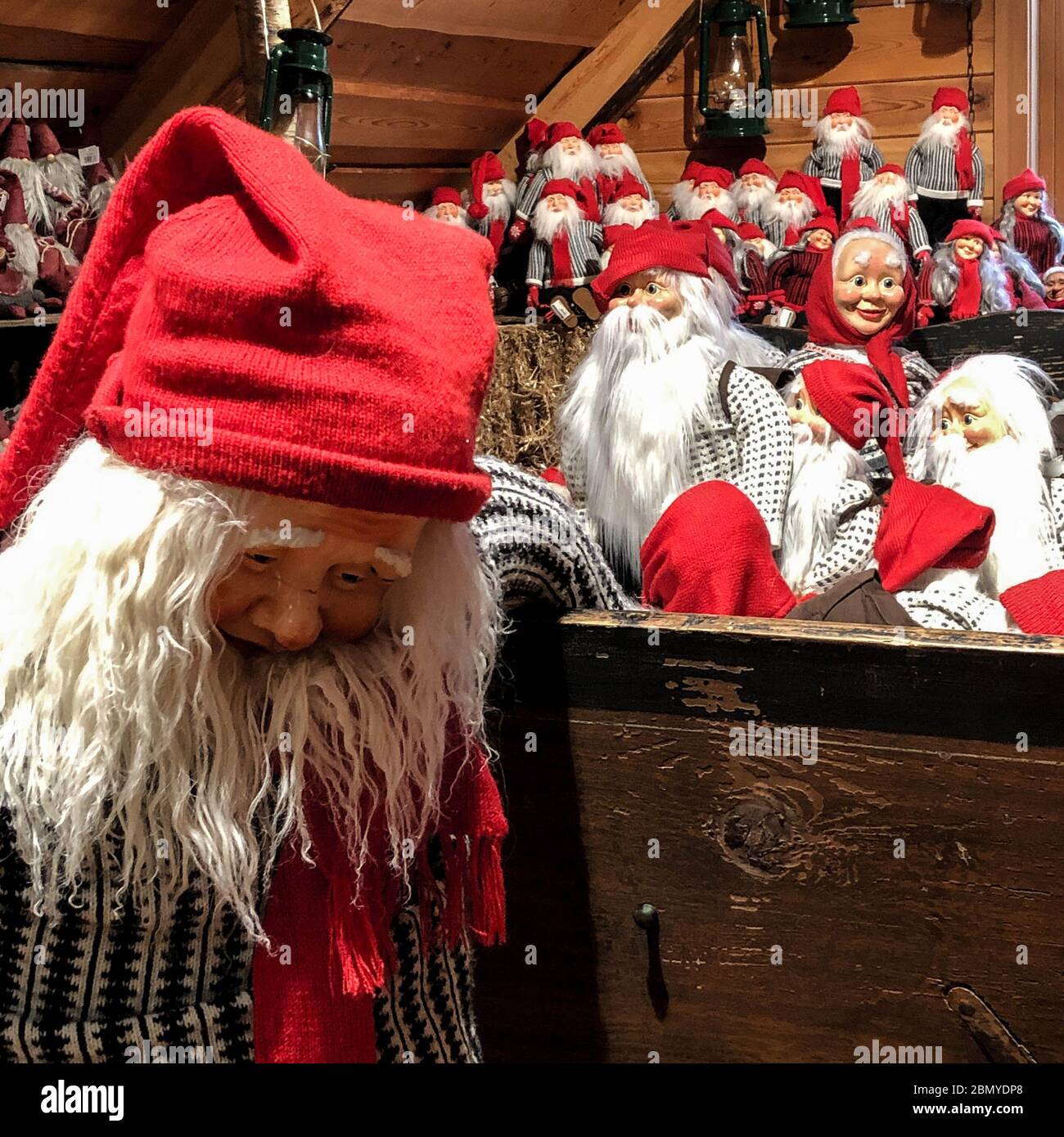 Collection Of Traditional Norwegian Santa Dolls And Helpers Wearing Authentic Red Hats Stock Photo
