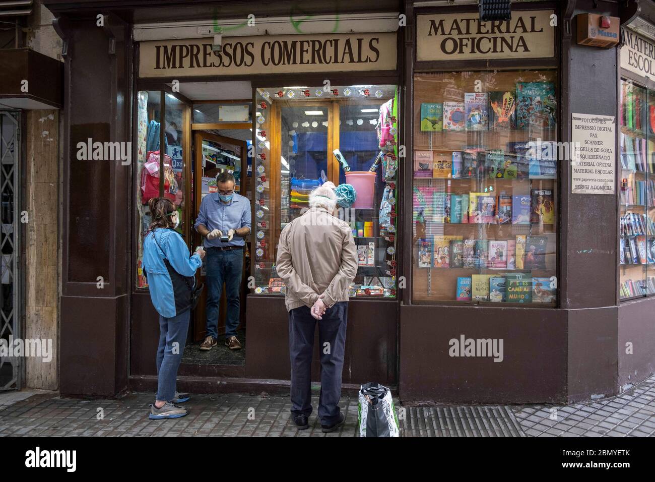 Barcelona, Spain. 9th May, 2020. Two clients of the Canut stationery shop  make purchases from abroad during the breakdown of the confinement with  Phase zero of the Covid-19.Proximity retail trade opens its