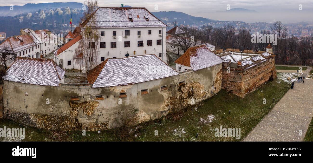 Brasov fortress citadel on Straja hill, Brasov, Romania. Aerial drone panoramic view Stock Photo