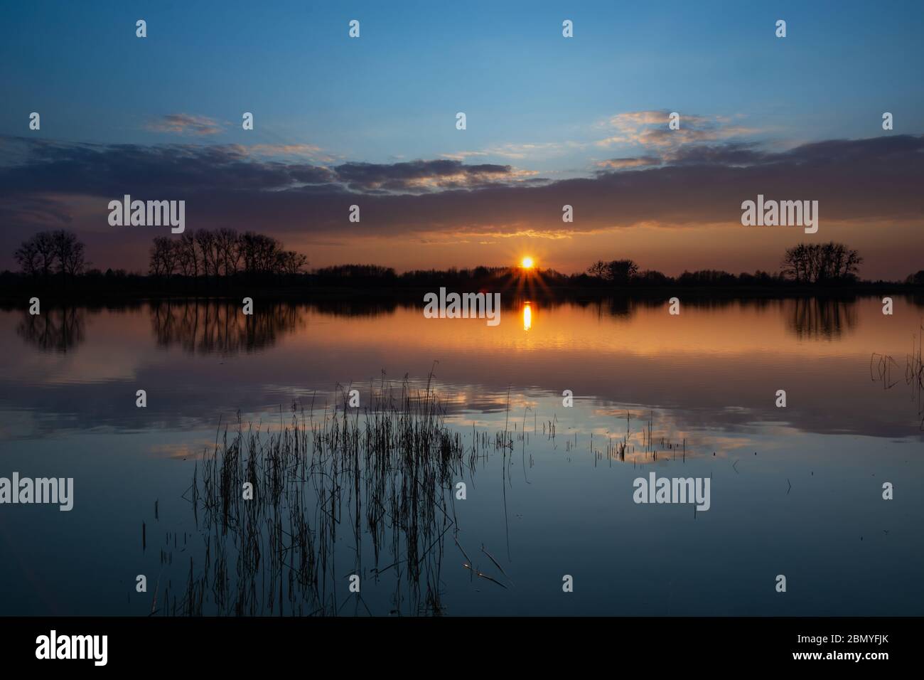Sunset sky reflecting in water hi-res stock photography and images - Alamy
