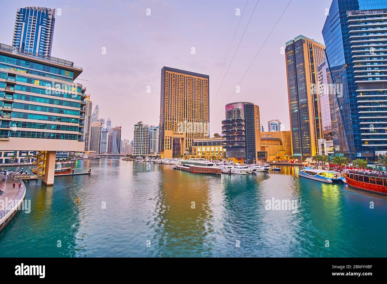 DUBAI, UAE - MARCH 2, 2020: Enjoy the sunset view of Dubai Marina with its modern highlights, such as fashionable Address Dubai Marina hotel, Marina M Stock Photo
