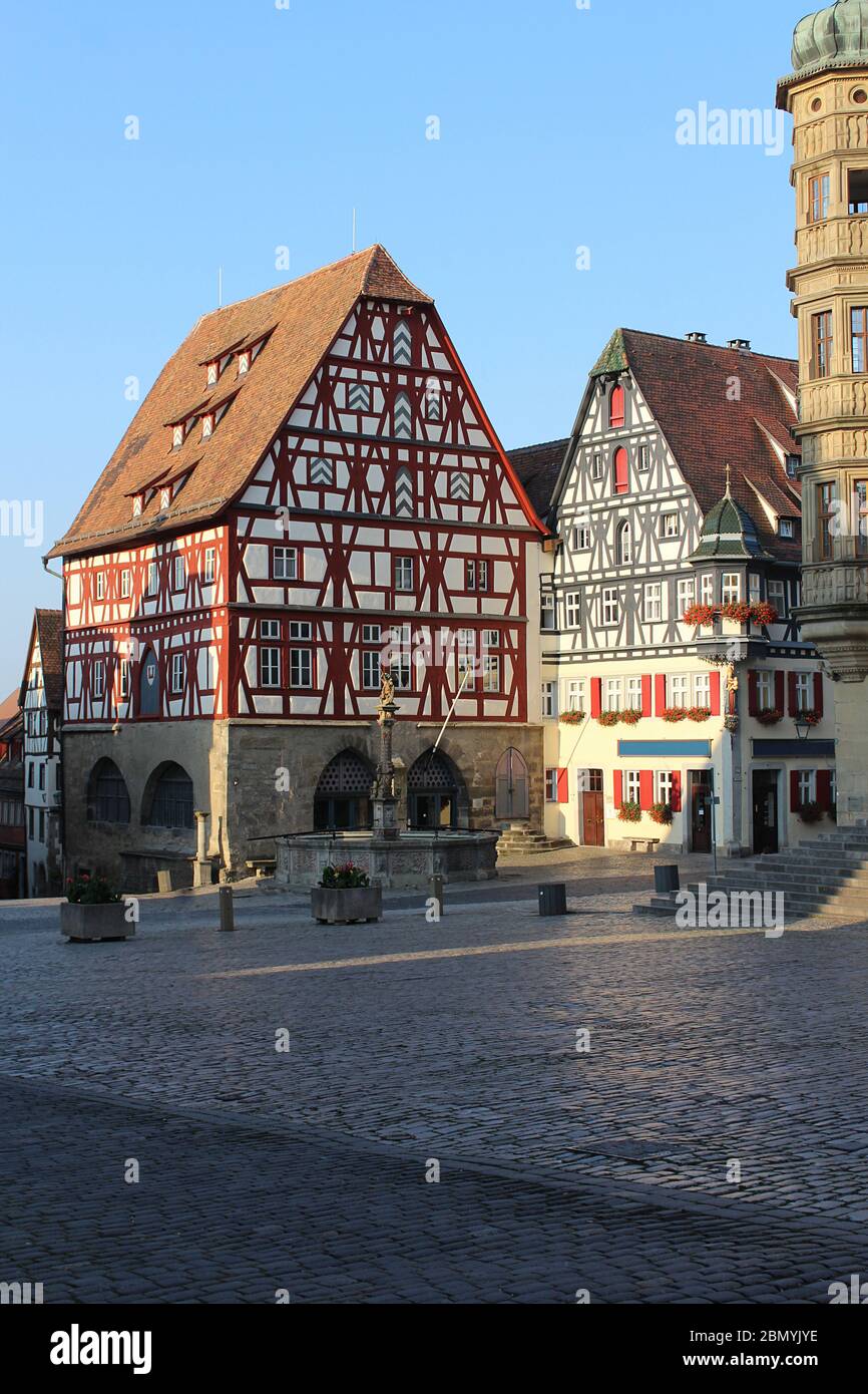 Two half-timbered houses at  market square of the medieval town Rothenburg ob der Tauber Stock Photo