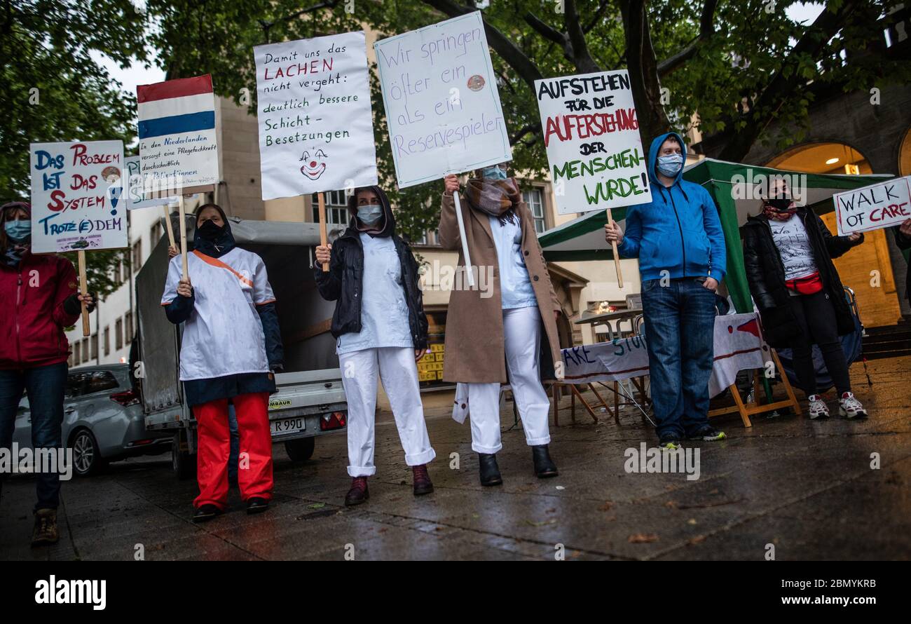 Stuttgart, Germany. 11th May, 2020. Nursing staff take part in the 24-hour vigil 'Walk of Care' on the Schlossplatz. The participants want to draw attention to abuses in care. Credit: Christoph Schmidt/dpa/Alamy Live News Stock Photo