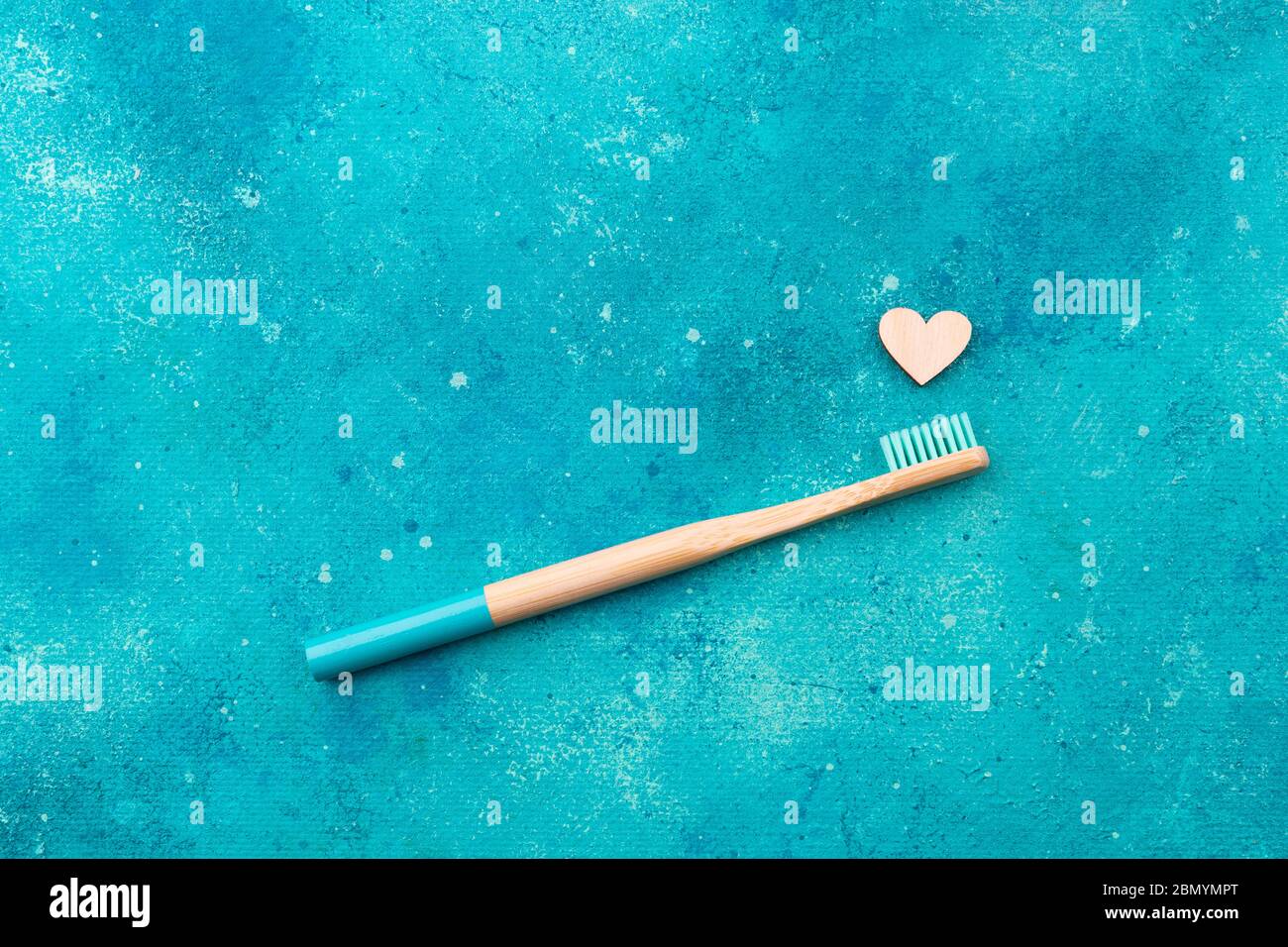 Eco friendly teeth hygiene oral dental care product on turquoise background with copy space