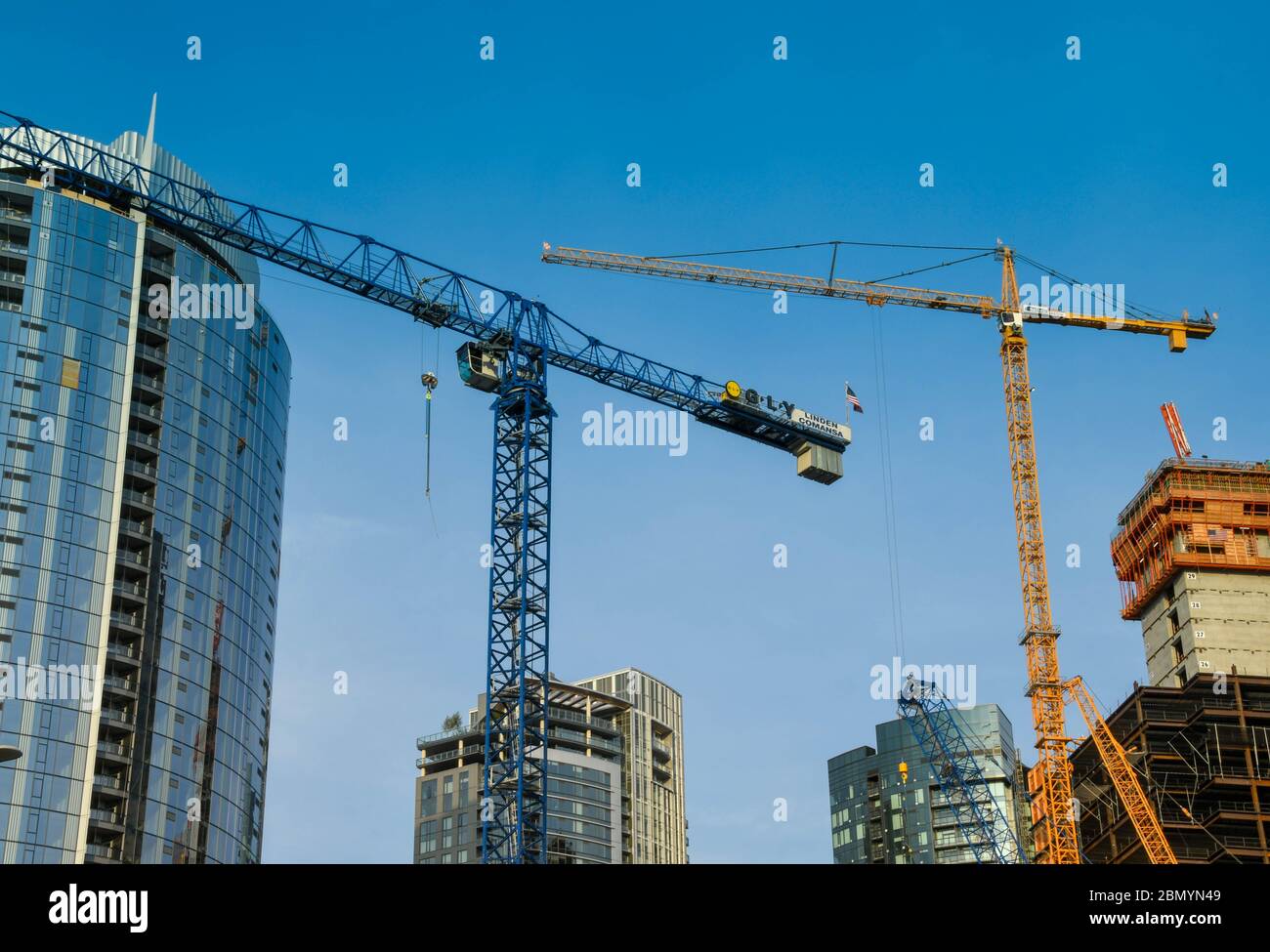 SEATTLE, WA, USA, - JUNE 2018: Tower cranes working on a major new development in downtown Seattle. Stock Photo