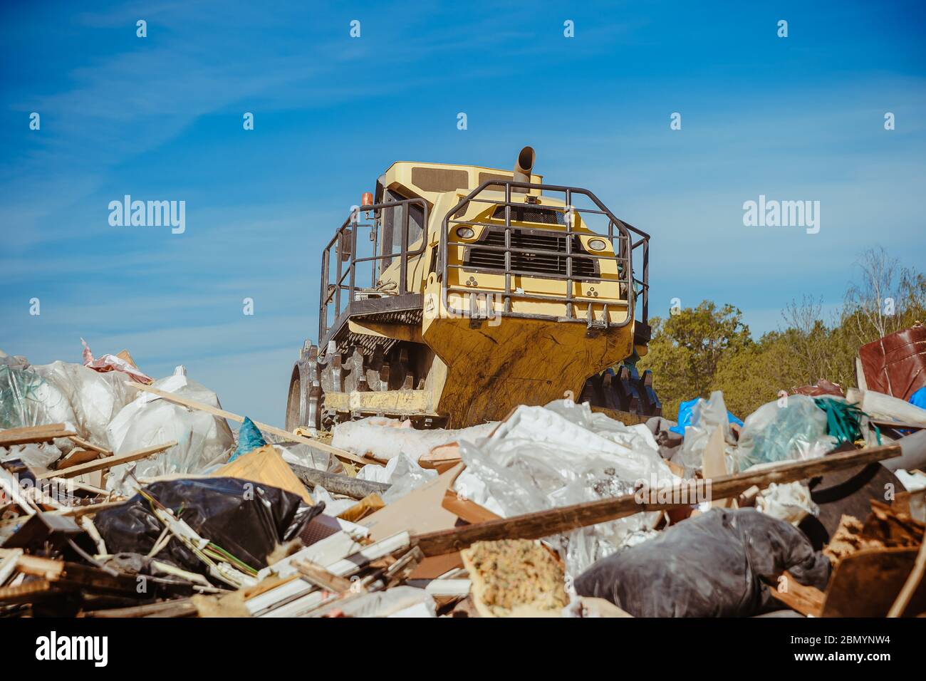 compactor at a landfill processing municipal waste Stock Photo Alamy