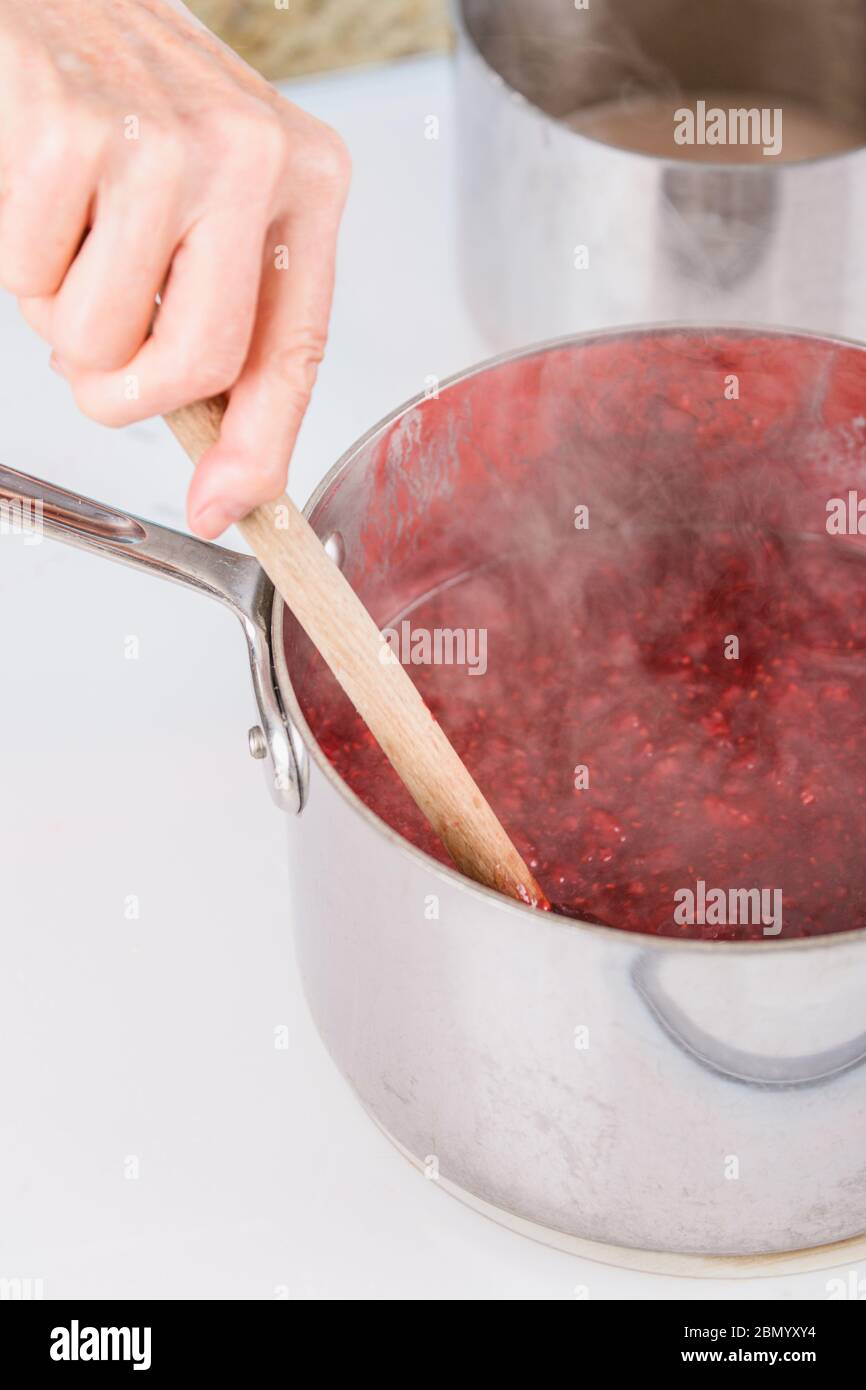 Mashed Raspberries Hand jam stove hi-res stock photography and images - Alamy