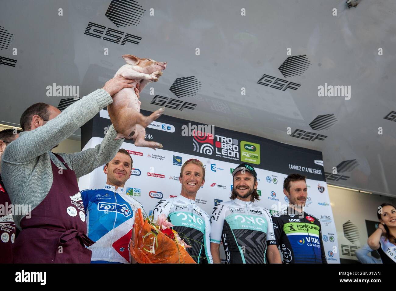 17.04.2016 Brittany, France. Laurent Pichon (Fra) FDJ wins the prize (a pig) for the best placed local rider. Tro-Bro Léon. Stock Photo