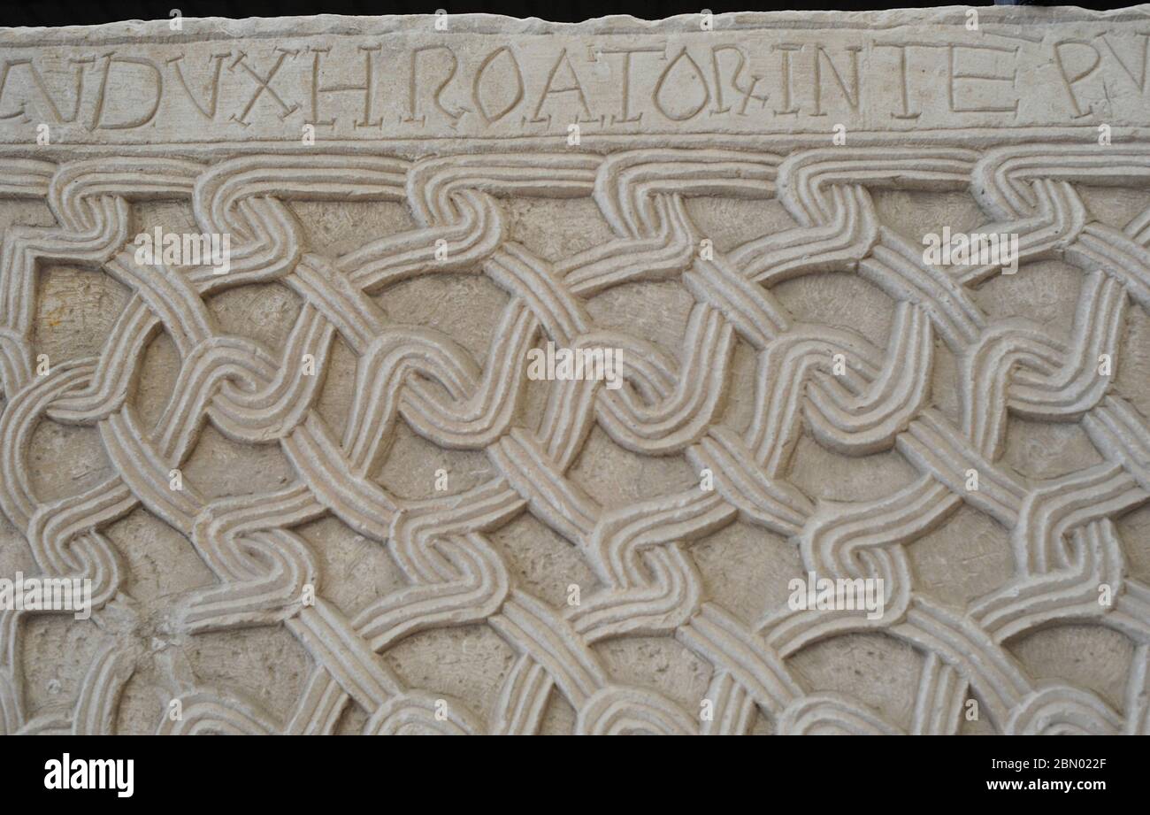 Ambo slabs with the names of Duke Svetoslav and Drzislav the Great Duke, from Kapitul, near Knin, 10th century. Inscription: 'Svetoslav Duke of the Croats in the reign of the Great Duke Drzislav'. Adorned with intertwined knots, circles and slanted geometric lines. Detail. Museum of Croatian Archaeological Monuments, Split, Croatia. Stock Photo