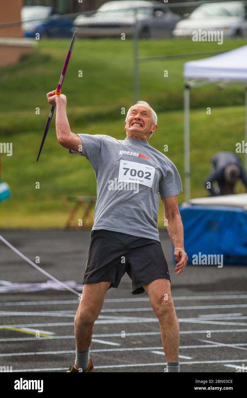 Competing in javelin throw, 70 year old male. Just before release. Stock Photo