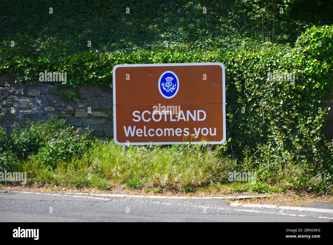 Scotland Welcomes You sign outside Coldstream, marking the point where UK Covid-19 coronavirus restrictions become more stringent when heading north Stock Photo