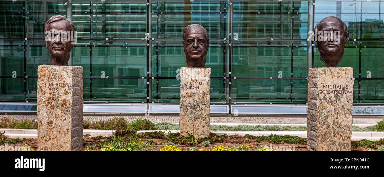 Sculptures of Politicians Bush, Gorbachev and Kohl in front of Axel Springer Building in Berlin, Germany Stock Photo