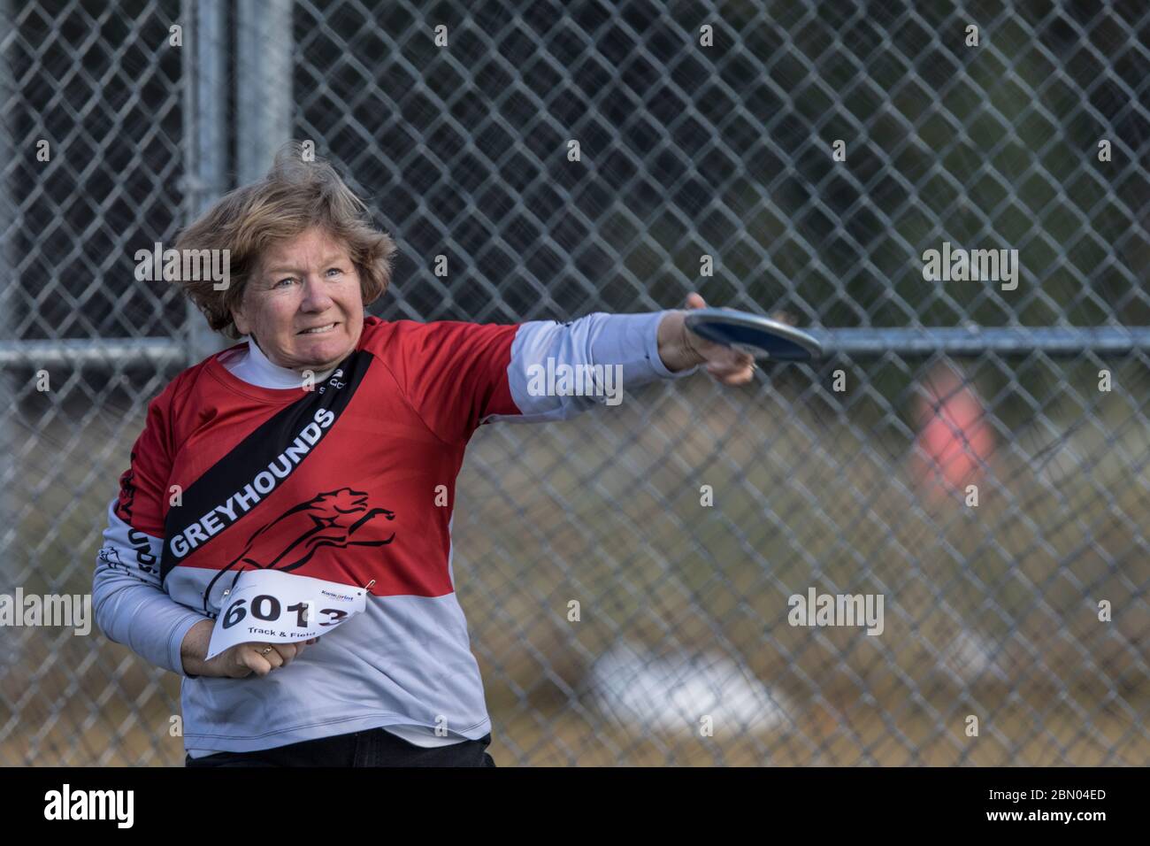 Senior Ladies Discus Throw competition. 60 year old age group, jusr releasing Stock Photo