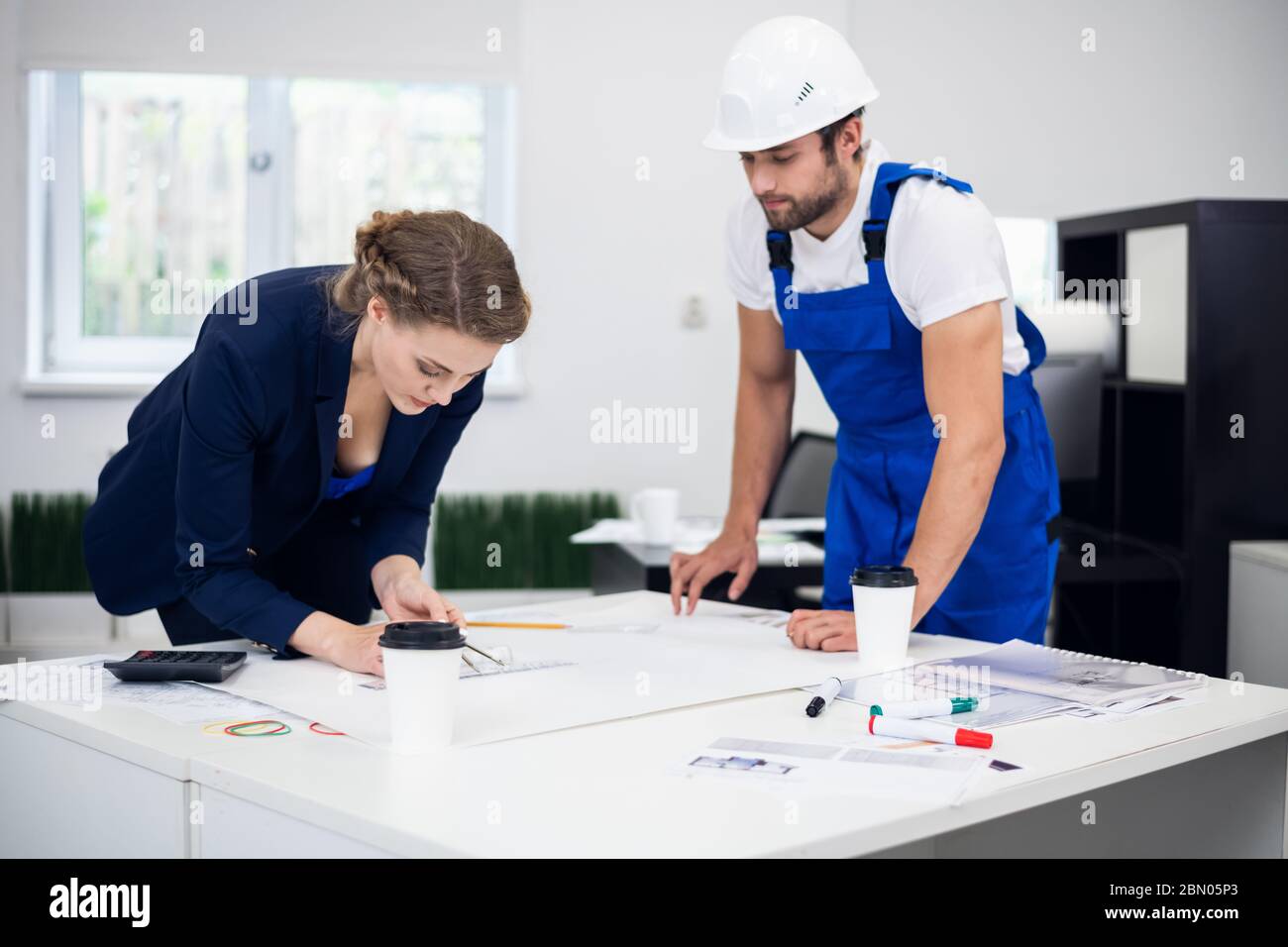 Two architects working on a project in the office Stock Photo