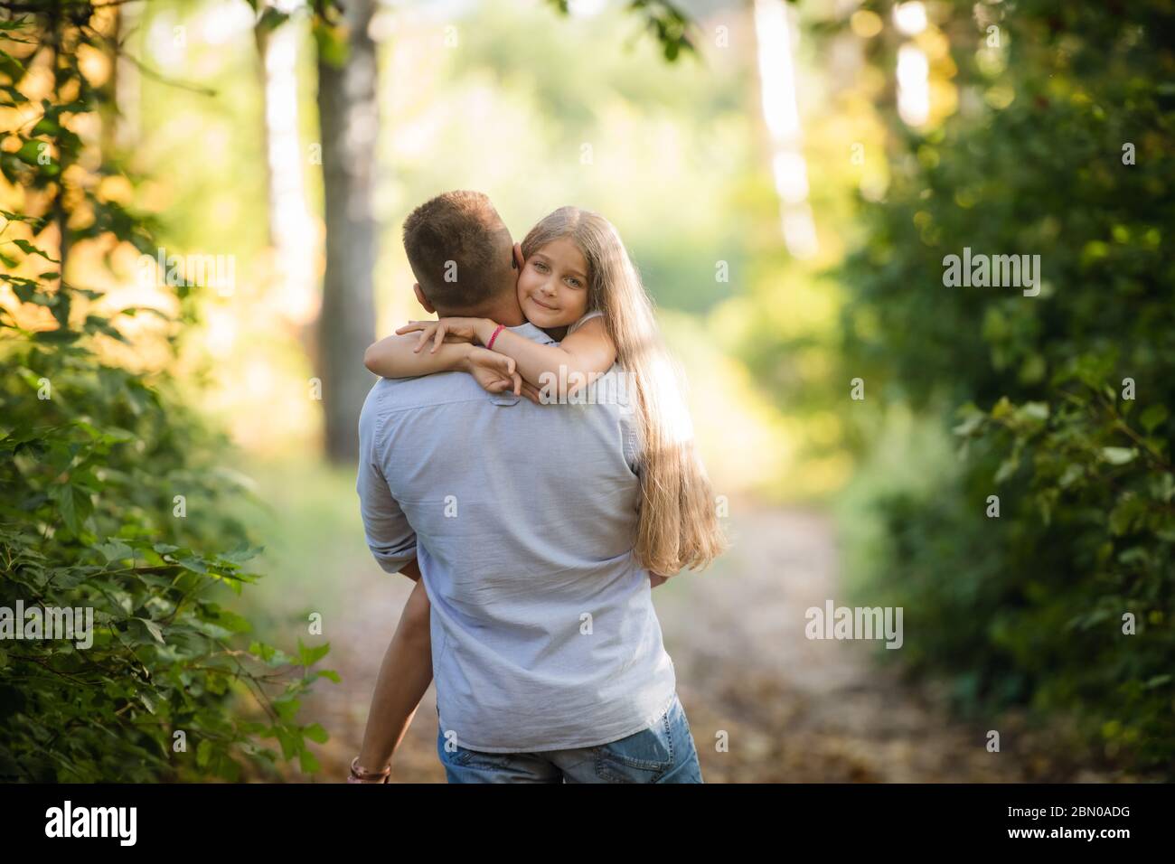 Happy daughter with her father in the park Stock Photo - Alamy
