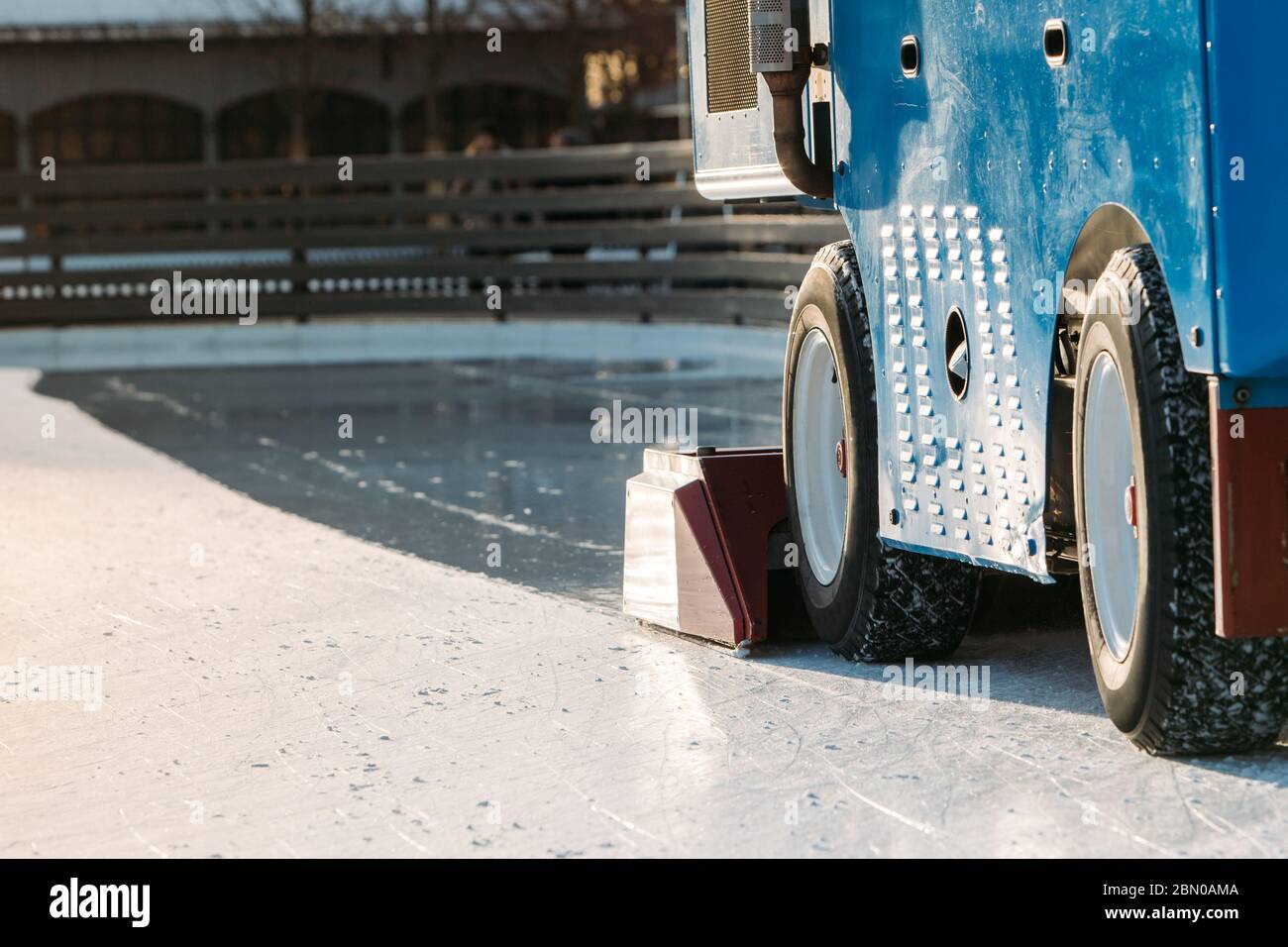 Ice preparation at the public rink between sessions at sunny winter day