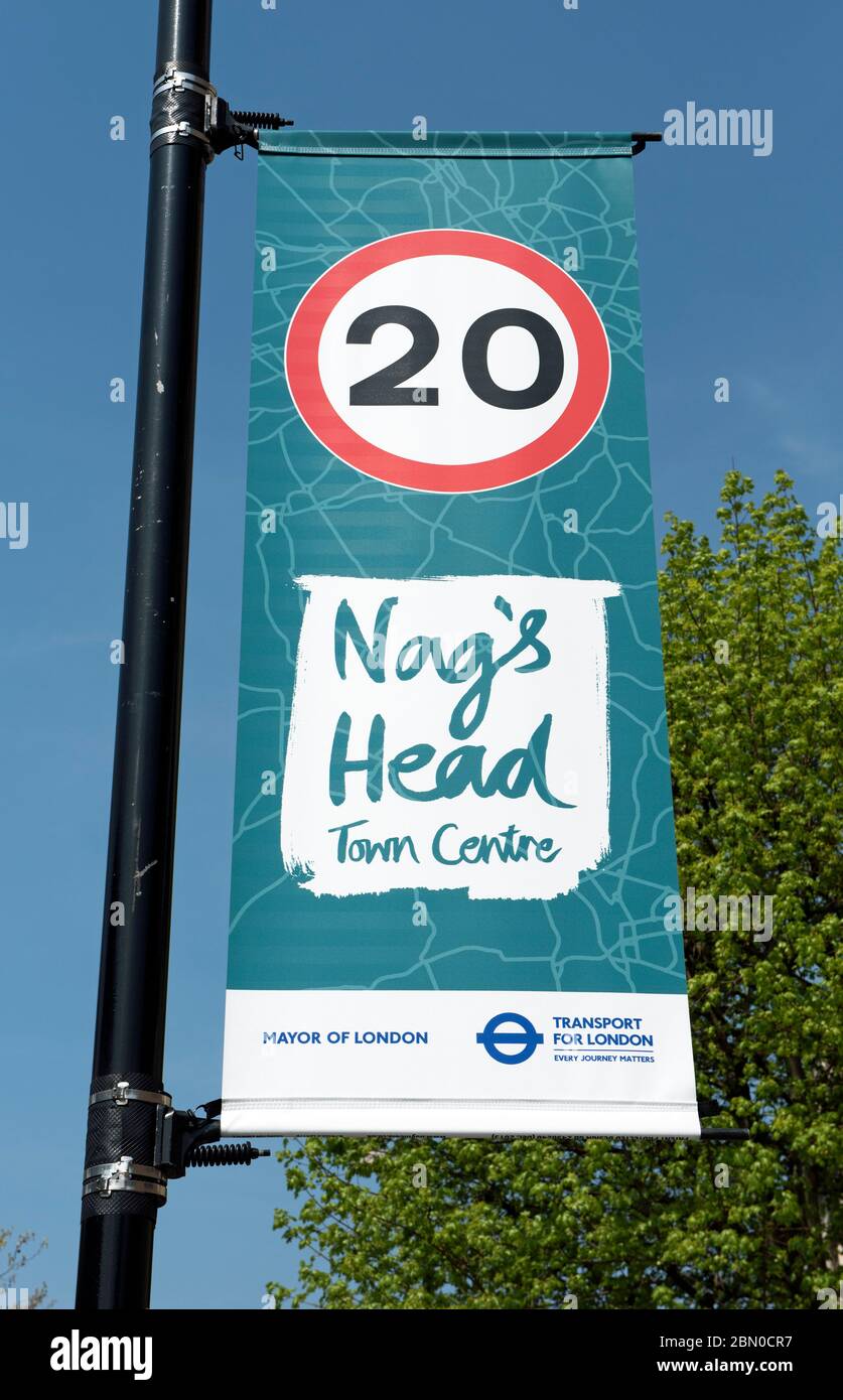 Nags Head Town Centre banner with 20 miles per hour speed limit sign, Holloway Road, London Borough of Islington England Britain UK Stock Photo